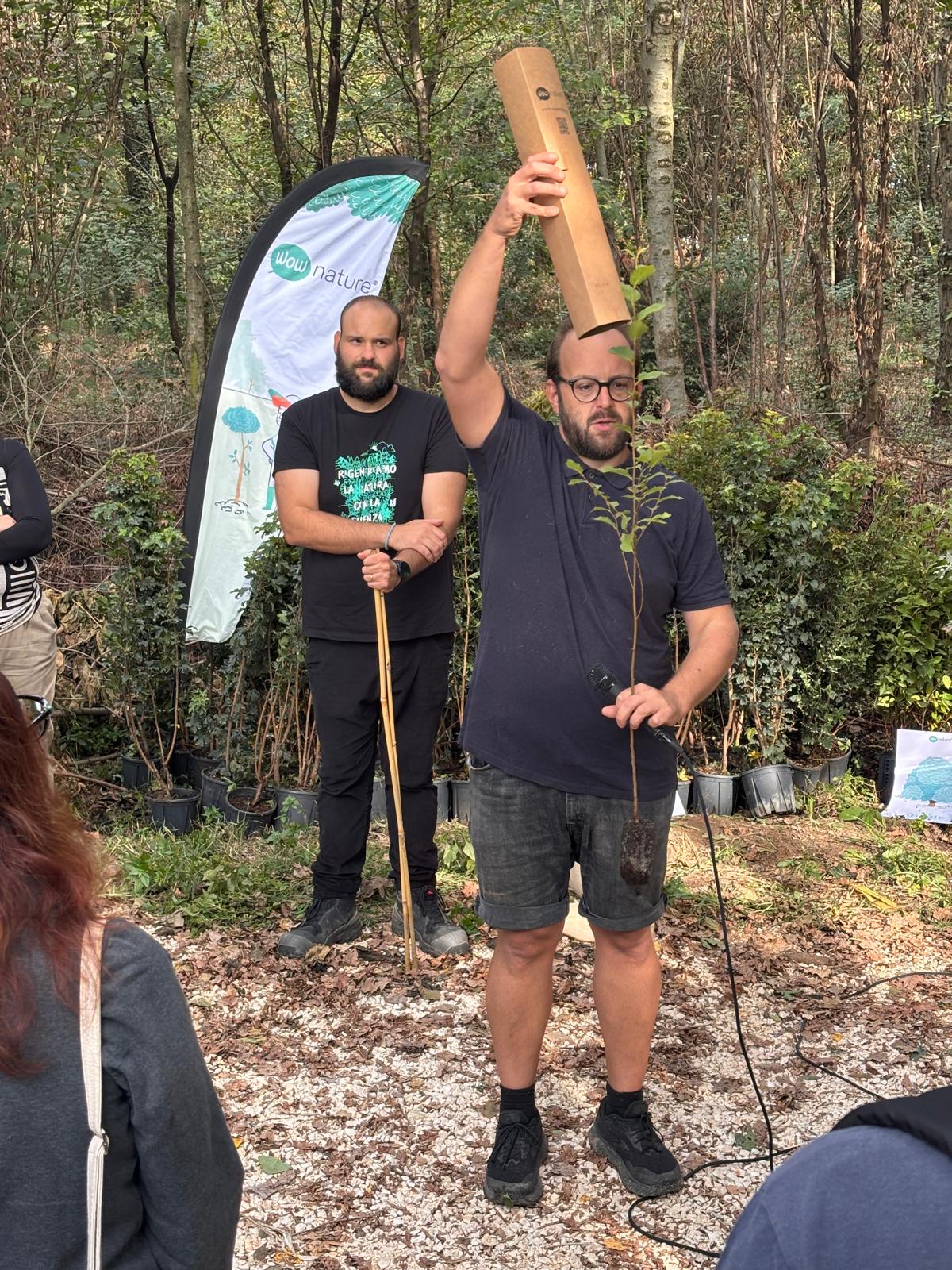 Etifor representative demonstrating tree planting